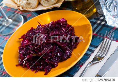 Braised red cabbage on a plate closeup 129769816