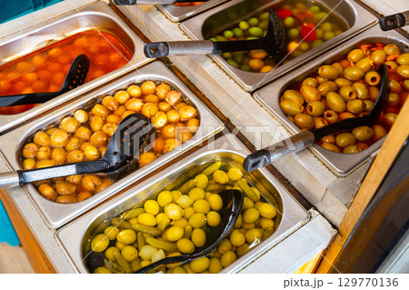 Variety of olives being sold at a market Variety of olives being sold at a market 129770136