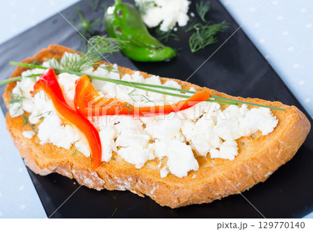 Toast with soft cheese and bell pepper Toast with soft cheese and bell pepper 129770140