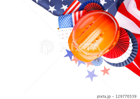 Colorful Labor Day decorations alongside a hard hat, isolated, PNG 129770539