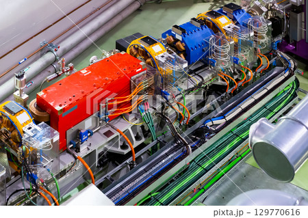 Synchrotron accelerator tunnel in synchrotron building 129770616