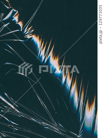 Crumpled foil. Glitch glow flare. Fiction color light wave scratch defocused black background copy space. Distressed gradient distortion surface. 129771035