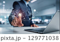 ビジネスマンがタッチパネルを指でタッチするポーズ、生成AIを活用したデジタルワークフロー 129771038