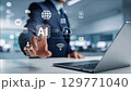 ビジネスマンがタッチパネルを指でタッチするポーズ、生成AIを活用したデジタルワークフロー 129771040