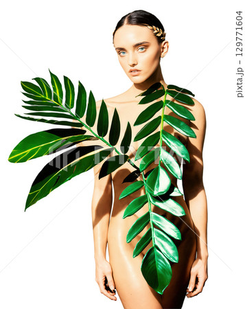 Botanical Fashion Zamioculcas leaves styled like a fashion editorial, with creative lighting and props. 129771604