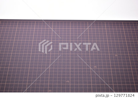 black cutting mat board on white background with line and scale measure guide pattern for art design 129771824