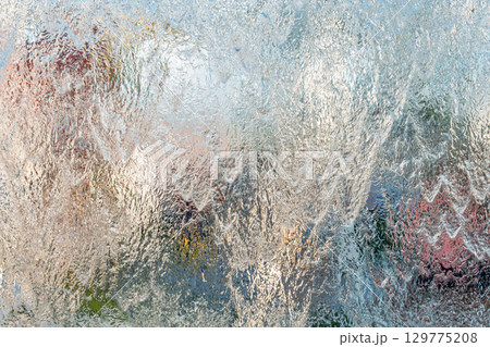 Aqua background. Product space next to clean water streams and water splashes and drops. Aqua background. Product space next to clean water streams and water splashes and drops. 129775208