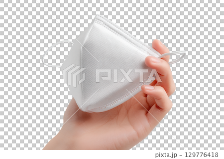 A hand holding a medical face mask. AI-generated item 129776418