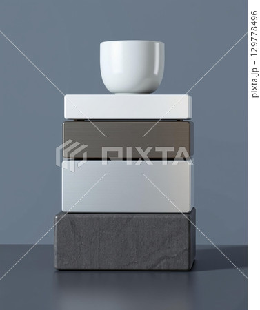 White bowl balanced on textured geometric blocks. a minimalist art piece. 129778496