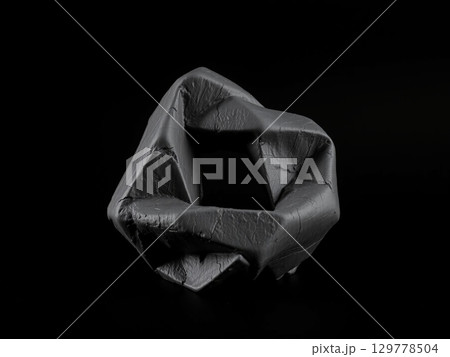 Abstract Dark Origami Sculpture Against Black Background 129778504
