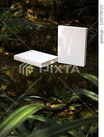 Blank book cover mockup on natural ground with green moss outdoor scene for design, branding, creativity, eco friendly concept, and inspirational presentation 129779722