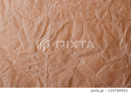 Brown crumpled paper for background Brown crumpled paper for background 129780403