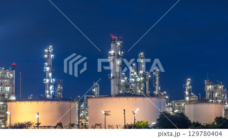 Oil and gas refinery plant at night, Global business energy logistic transportation, Oil and gas refinery petrochemical industrial, Petrochemical refinery industrial energy supply chain. 129780404