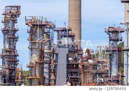 Oil and Gas refinery petrochemical plant industrial on blue sky background, Oil and Gas refinery petrochemical plant pipeline steel, Oil and Gas refinery factory maintenance, Global energy refinery. Oil and Gas refinery petrochemical plant industrial on blue sky background, Oil and Gas refinery petrochemical plant pipeline steel, Oil and Gas refinery factory maintenance, Global energy refinery. 129780419