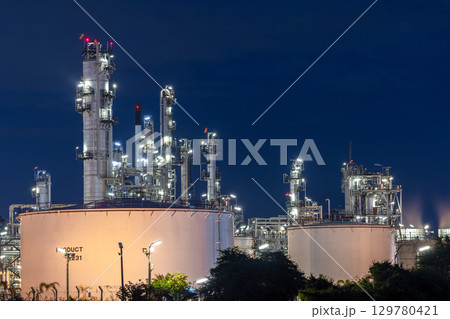 Oil and gas refinery plant at night, Global business energy logistic transportation, Oil and gas refinery petrochemical industrial, Petrochemical refinery industrial energy supply chain. 129780421