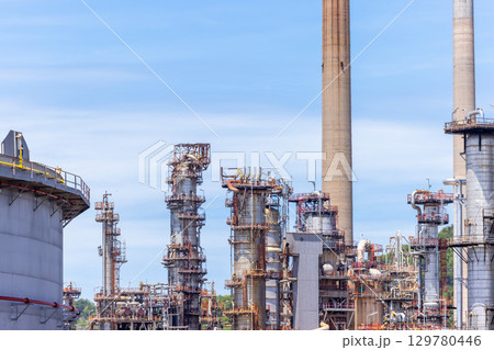 Oil and Gas refinery petrochemical plant industrial on blue sky background, Oil and Gas refinery petrochemical plant pipeline steel, Oil and Gas refinery factory maintenance, Global energy refinery. 129780446