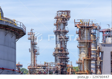 Oil and Gas refinery petrochemical plant industrial on blue sky background, Oil and Gas refinery petrochemical plant pipeline steel, Oil and Gas refinery factory maintenance, Global energy refinery. Oil and Gas refinery petrochemical plant industrial on blue sky background, Oil and Gas refinery petrochemical plant pipeline steel, Oil and Gas refinery factory maintenance, Global energy refinery. 129780447