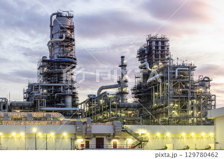Oil and Gas refinery petrochemical plant industrial on sunset background, Oil and Gas refinery petrochemical plant pipeline steel, Oil and Gas refinery factory maintenance, Global energy refinery. 129780462