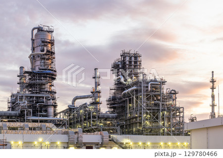 Oil and Gas refinery petrochemical plant industrial on sunset background, Oil and Gas refinery petrochemical plant pipeline steel, Oil and Gas refinery factory maintenance, Global energy refinery. 129780466