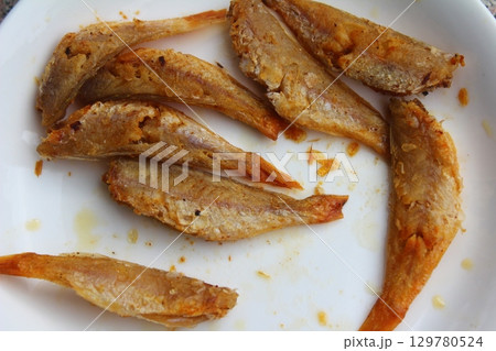 dried fish in basket and plate dried fish in basket and plate 129780524