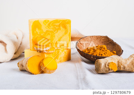 Natural homemade rejuvenating soap with turmeric on the table 129780679