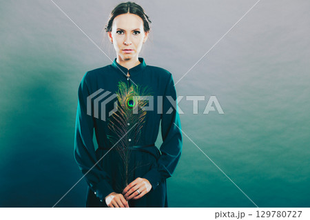 Girl with the peacock feathers 129780727