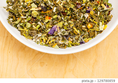 Dried herb leaves in bowl 129780859