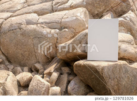 Standing book mockup on natural rock with background of large stones outdoor rustic scene for education publishing branding design stationery and creative presentation concepts 129781026