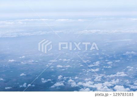 Sky and clouds background from above on Earth 129783183