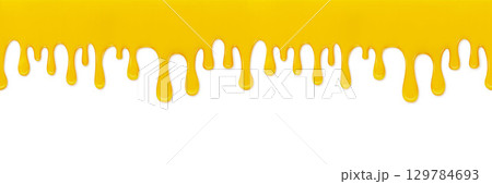 Yellow Liquid Drips Down against a White Background for Abstract Design Yellow Liquid Drips Down against a White Background for Abstract Design 129784693
