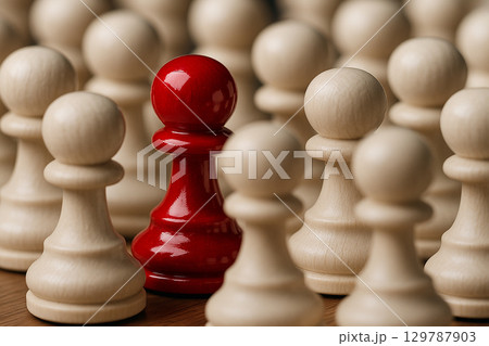 Central red pawn leading aligned white pawns demonstrating courage, influence, and active leadership Central red pawn leading aligned white pawns demonstrating courage, influence, and active leadership 129787903
