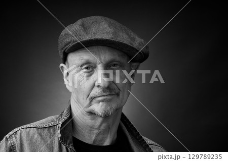 Portrait of a senior man in a vintage Harcourt style lighting Portrait of a senior man in a vintage Harcourt style lighting 129789235