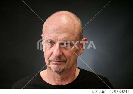Portrait of a senior man in a vintage Harcourt style lighting Portrait of a senior man in a vintage Harcourt style lighting 129789246