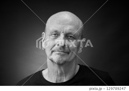 Monochrome Portrait of a senior man in a vintage Harcourt style lighting 129789247