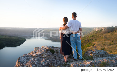 Girl and guy on the hill Girl and guy on the hill 129791202