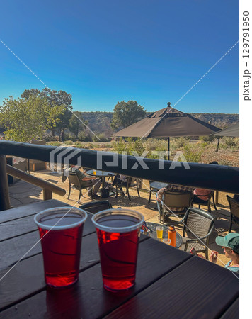 Two red drinks on patio table in Grand Canyon National Park 129791950