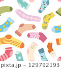 seamless background of multi-colored socks with patterns and stripes 129792193