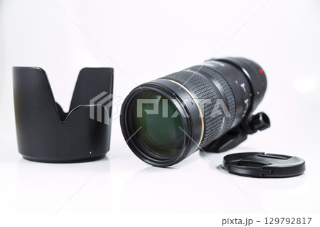Black telephoto lens isolated on white background. Black telephoto lens isolated on white background. 129792817