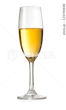 Champagne flute containing sparkling white wine on white background 129794696