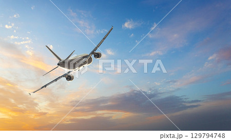 Airplane flying high above orange clouds during sunset Airplane flying high above orange clouds during sunset 129794748