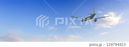 Passenger airplane flying in blue sky with few clouds Passenger airplane flying in blue sky with few clouds 129794823