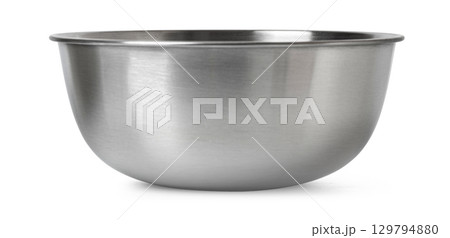 Shiny stainless steel mixing bowl on white surface 129794880