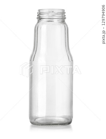 Empty glass bottle standing on white background 129794906