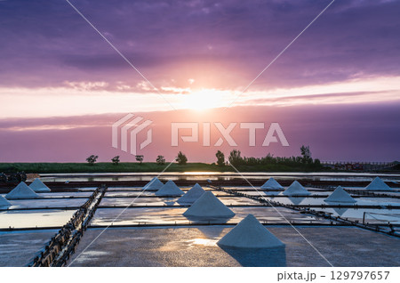 Sunset Light and Moving Clouds Over Salt Fields in Qigu, Tainan City, Taiwan. Sunset Light and Moving Clouds Over Salt Fields in Qigu, Tainan City, Taiwan. 129797657