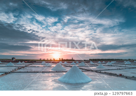 Sunset Light and Moving Clouds Over Salt Fields in Qigu, Tainan City, Taiwan. Sunset Light and Moving Clouds Over Salt Fields in Qigu, Tainan City, Taiwan. 129797663