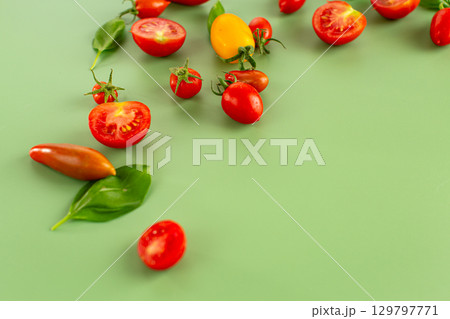 Assorted cherry tomatoes halves seeds and juicy pulp closeup 129797771