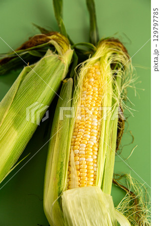 macro image of corn cob with leaves and silk macro image of corn cob with leaves and silk 129797785