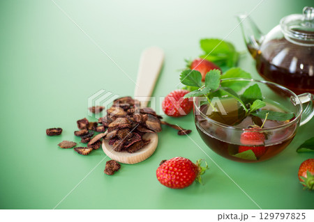 Brewed fruit tea with strawberries, minimalism and color 129797825