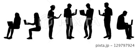 Businessman and woman working on laptop silhouette, woman man in front of laptop 129797924