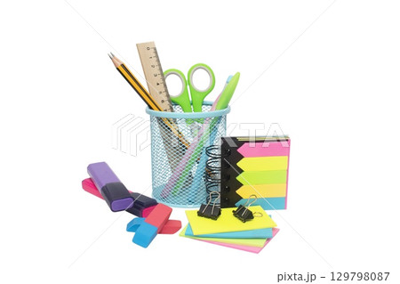 School and office supplies, pens, pencils, ruler, compass in a metal cup on a white background. School and office supplies, pens, pencils, ruler, compass in a metal cup on a white background. 129798087